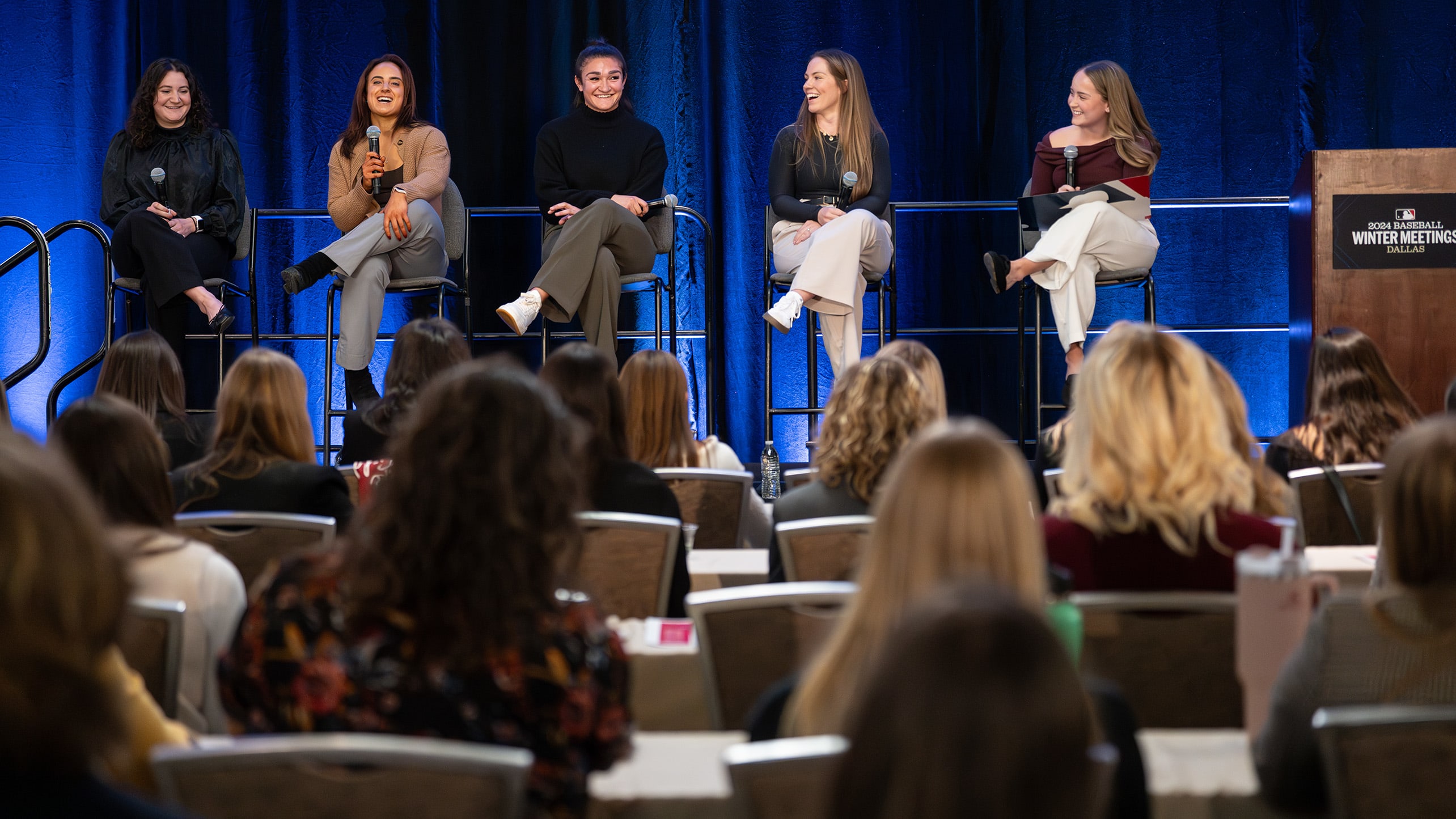 Panelists lead a discussion at an event for the Take the Field initiative