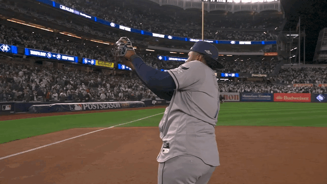 An animated gif of Junior Caminero making a sweeping motion after the game at Yankee Stadium