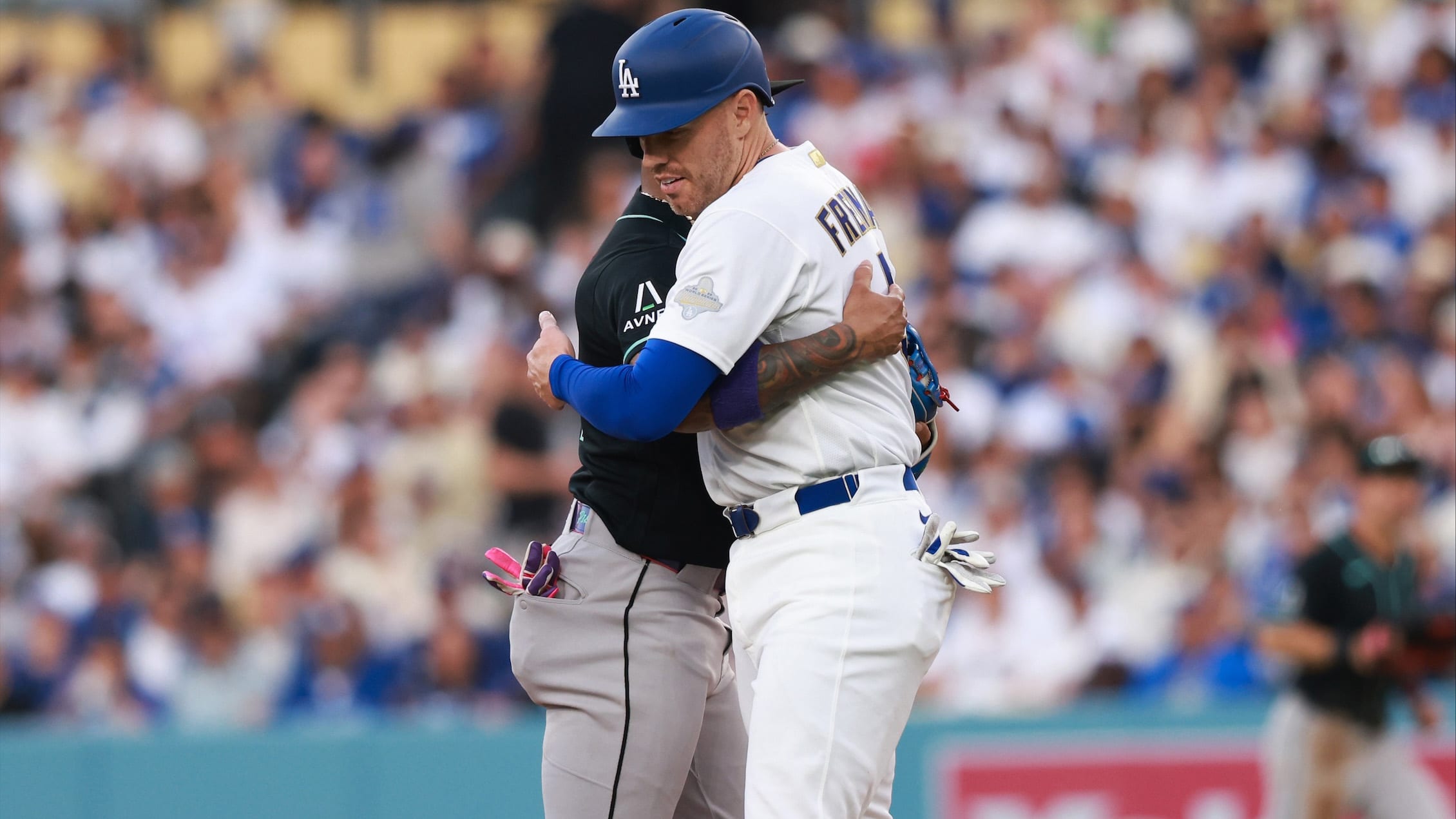 Ketel Marte hugs Freddie Freeman