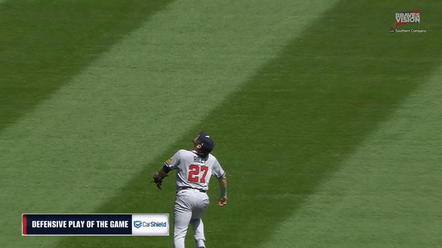An animated gif of Braves third baseman Austin Riley making an over-the-shoulder catch in short left field