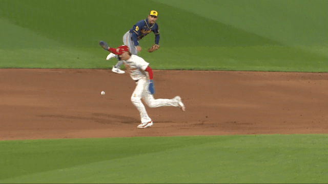 An animated gif of Brewers shortstop Joey Ortiz making a diving stop on the infield