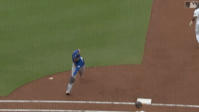 An animated gif of Freddie Freeman making a jump throw for an out