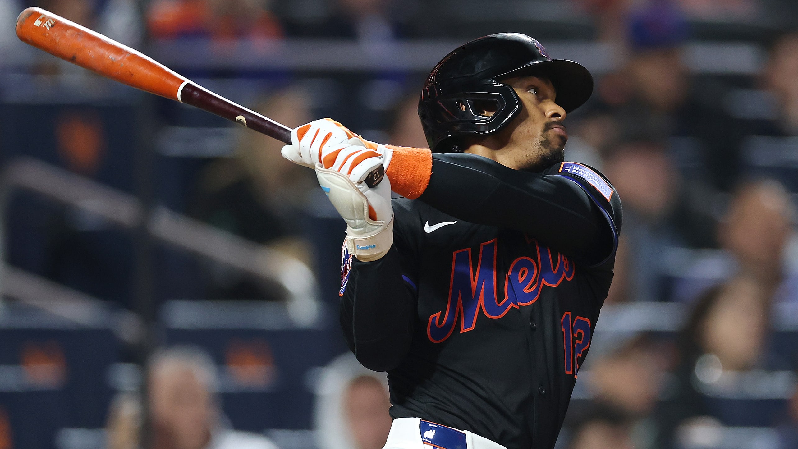 Francisco Lindor watches the flight of a home run