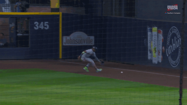An animated gif of Ronald Acuña Jr. firing a throw from the right-field corner to second base on the fly
