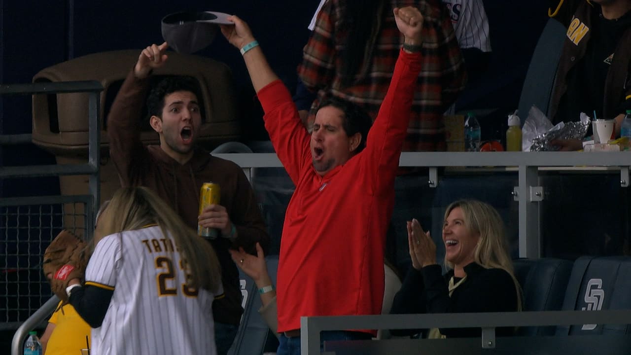 A Padres fan celebrates his foul ball catch