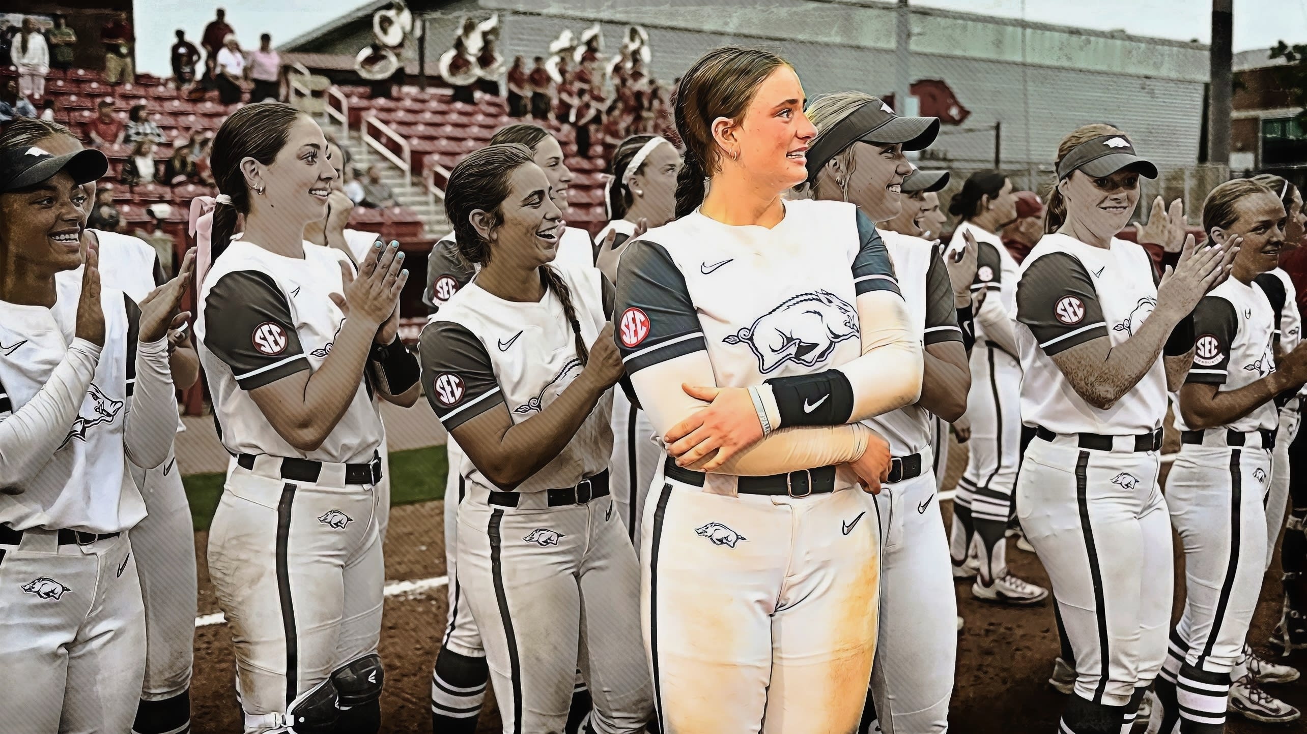 Softball player Bri Ellis is highlighted in a photo of her with her college teammates