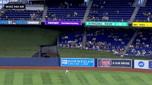 An animated gif of Dane Myers making a leaping catch against the wall