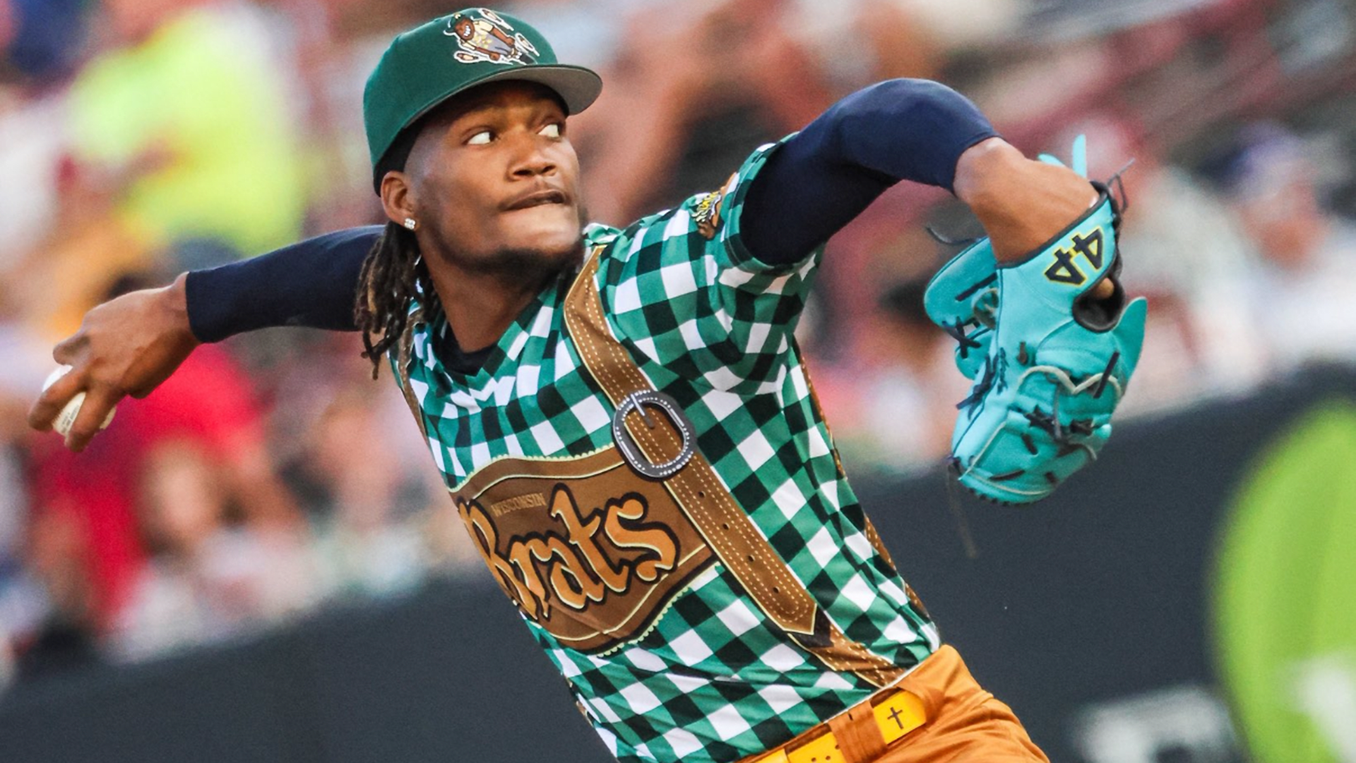 Abner Uribe pitches in a lederhosen-style Minor League uniform