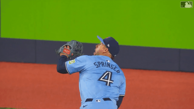 An animated GIF of George Springer making a diving catch