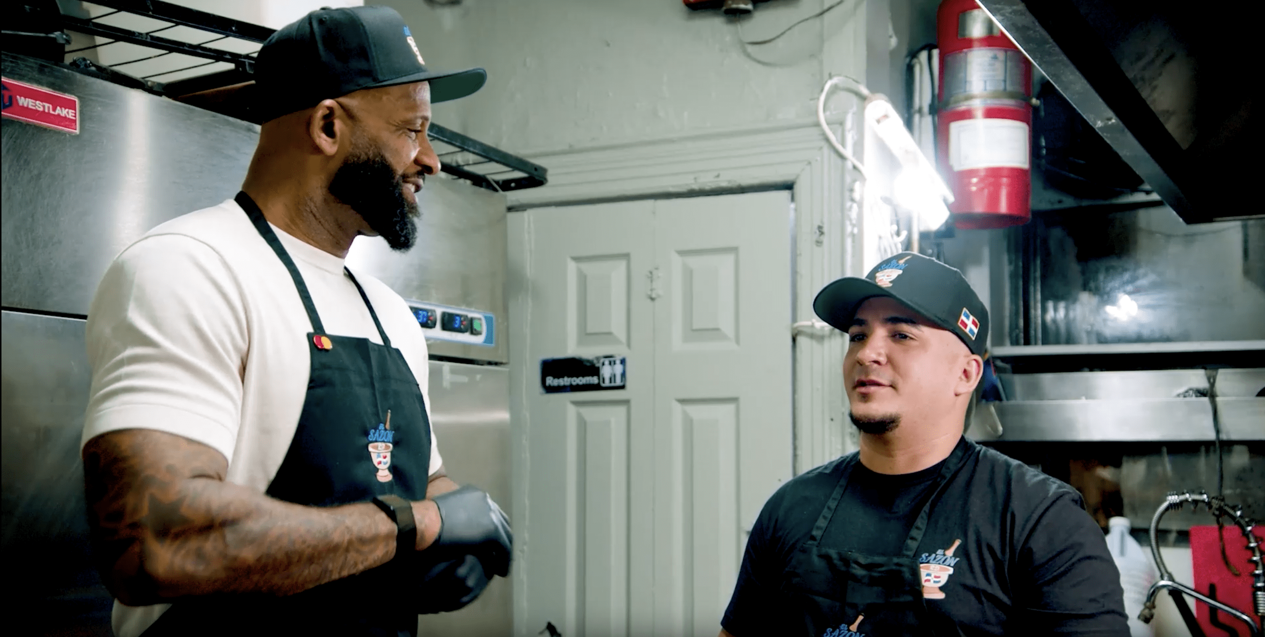 CC Sabathia and a restaurant worker at El Sazon in New York City