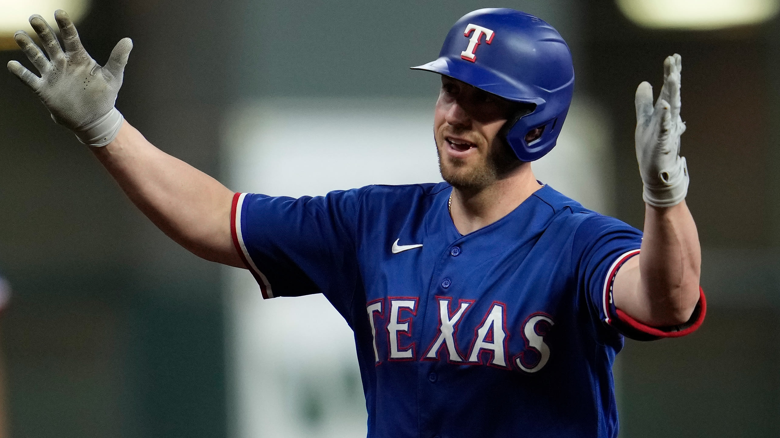 Mitch Garver gestures to his teammates