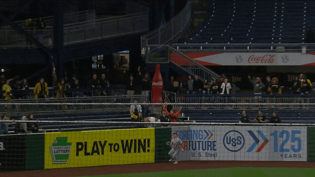 An animated gif of Cardinals left fielder Nathan Church leaping to rob a home run