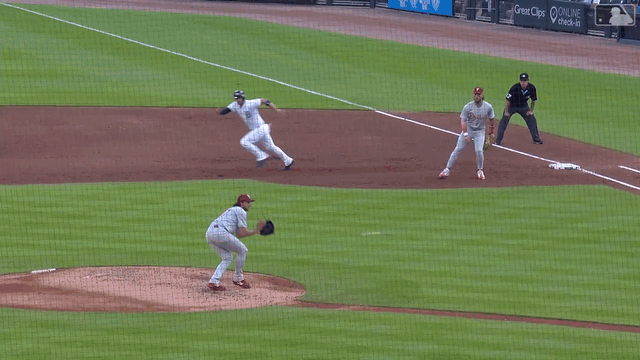 Phillies pitcher Aaron Nola starts a triple play