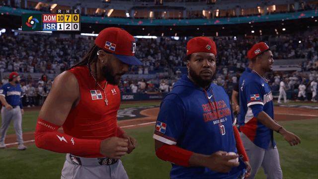 An animated gif of Fernando Tatis Jr. and Vladimir Guerrero Jr. dancing after the game