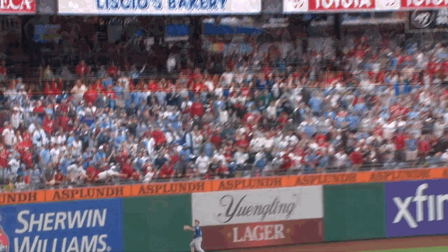 An animated gif of Alan Roden making a catch against the wall