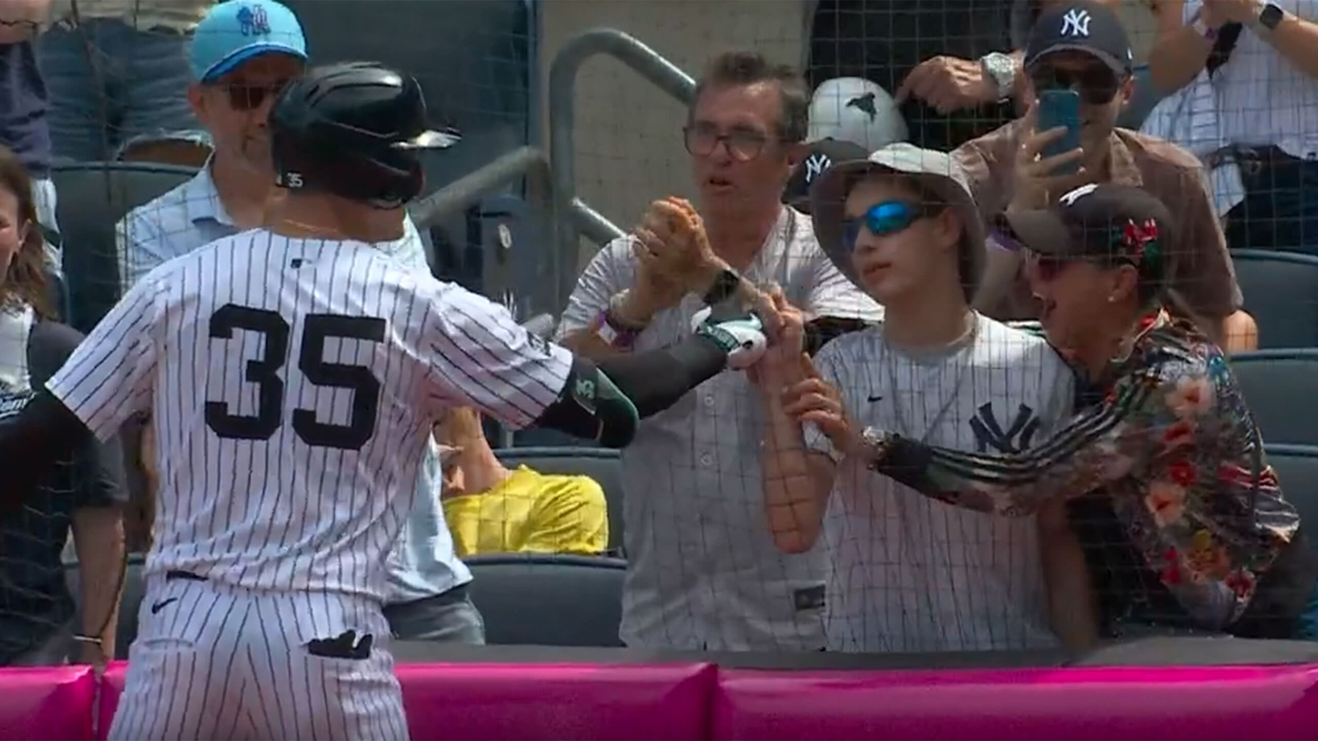 Cody Bellinger fist bumps a young fan