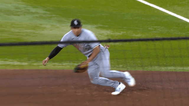 Munetaka Murakami makes a diving stop