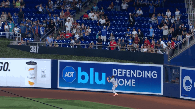 An animated gif of Ronald Acuña Jr. making a leaping catch at the wall