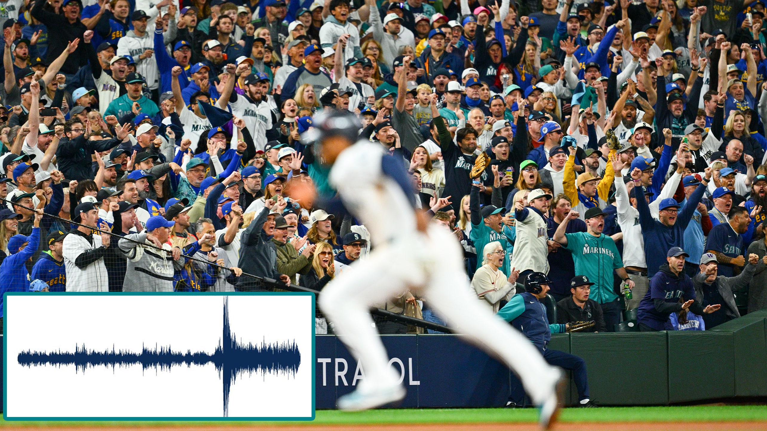 Fans cheer as a Mariners baserunner sprints between bases
