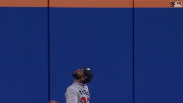 An animated gif of Michael Harris II robbing a home run