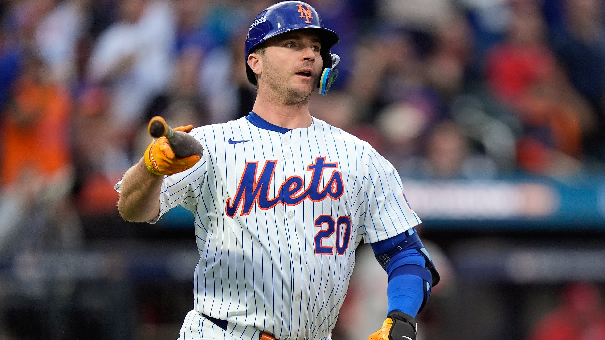 Pete Alonso prepares to drop his bat as he watches his home run