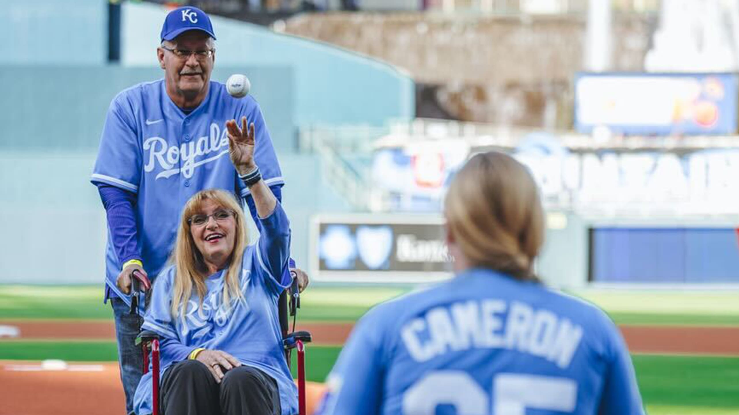 Noah Cameron's mom Diane throws the ceremonial first pitch