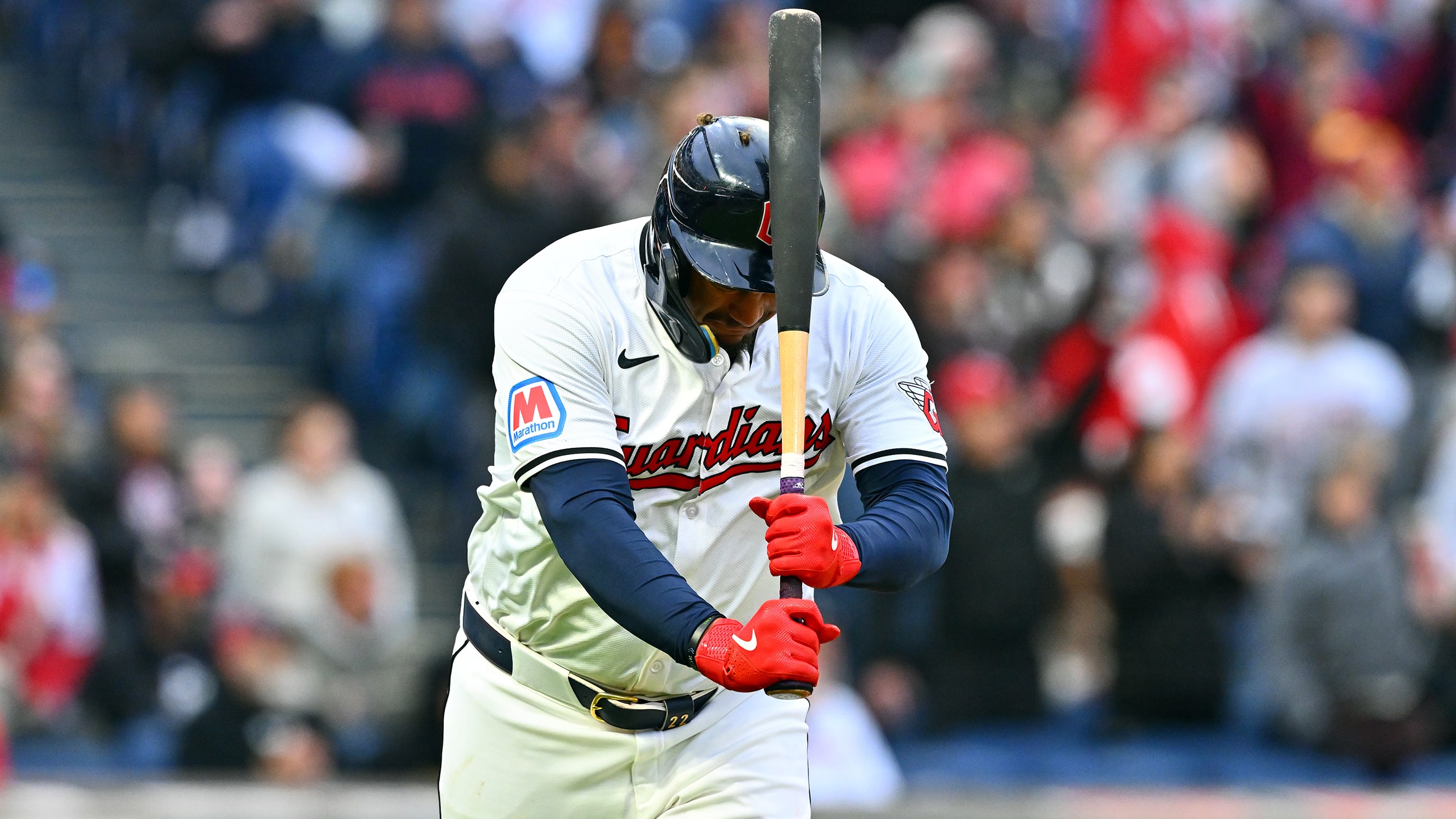 Josh Naylor hits himself in the helmet with his bat