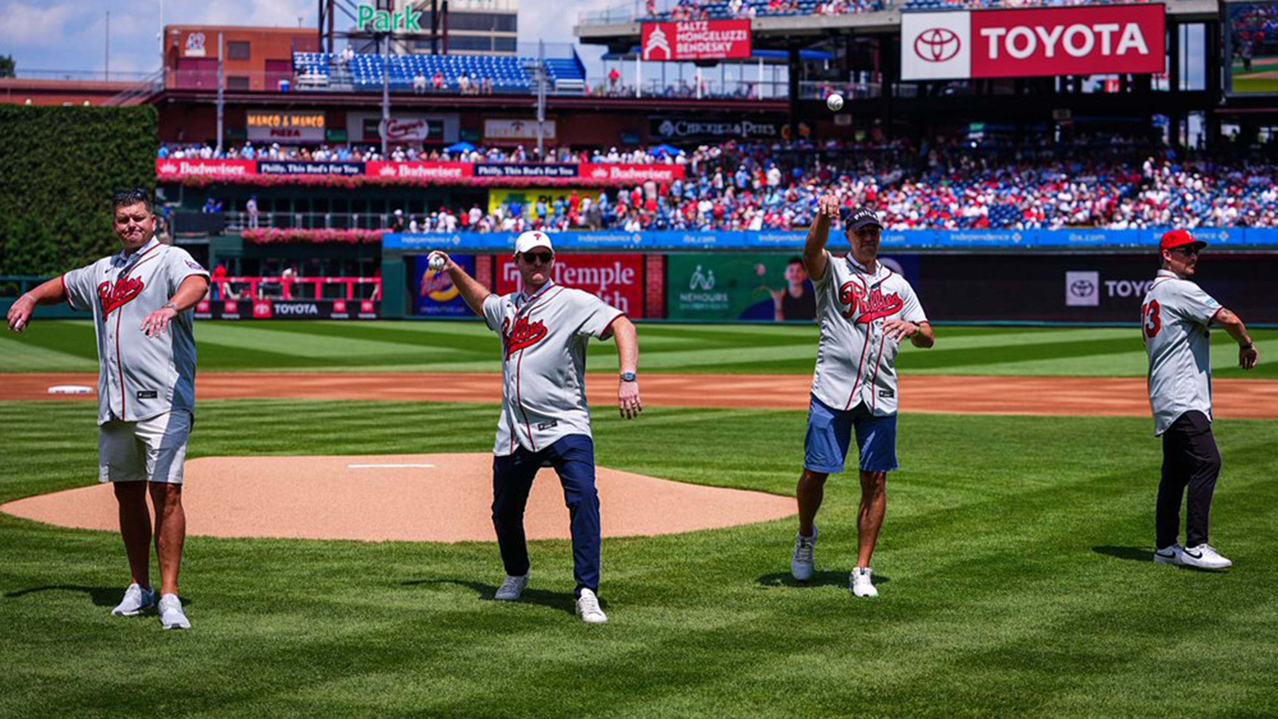 Four former Major Leaguers who never appeared in a game throw out ceremonial first pitches