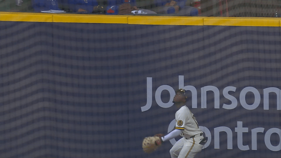 An animated gif of Luis Lara making a leaping catch at the wall