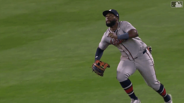 An animated gif of Michael Harris II making a sliding catch