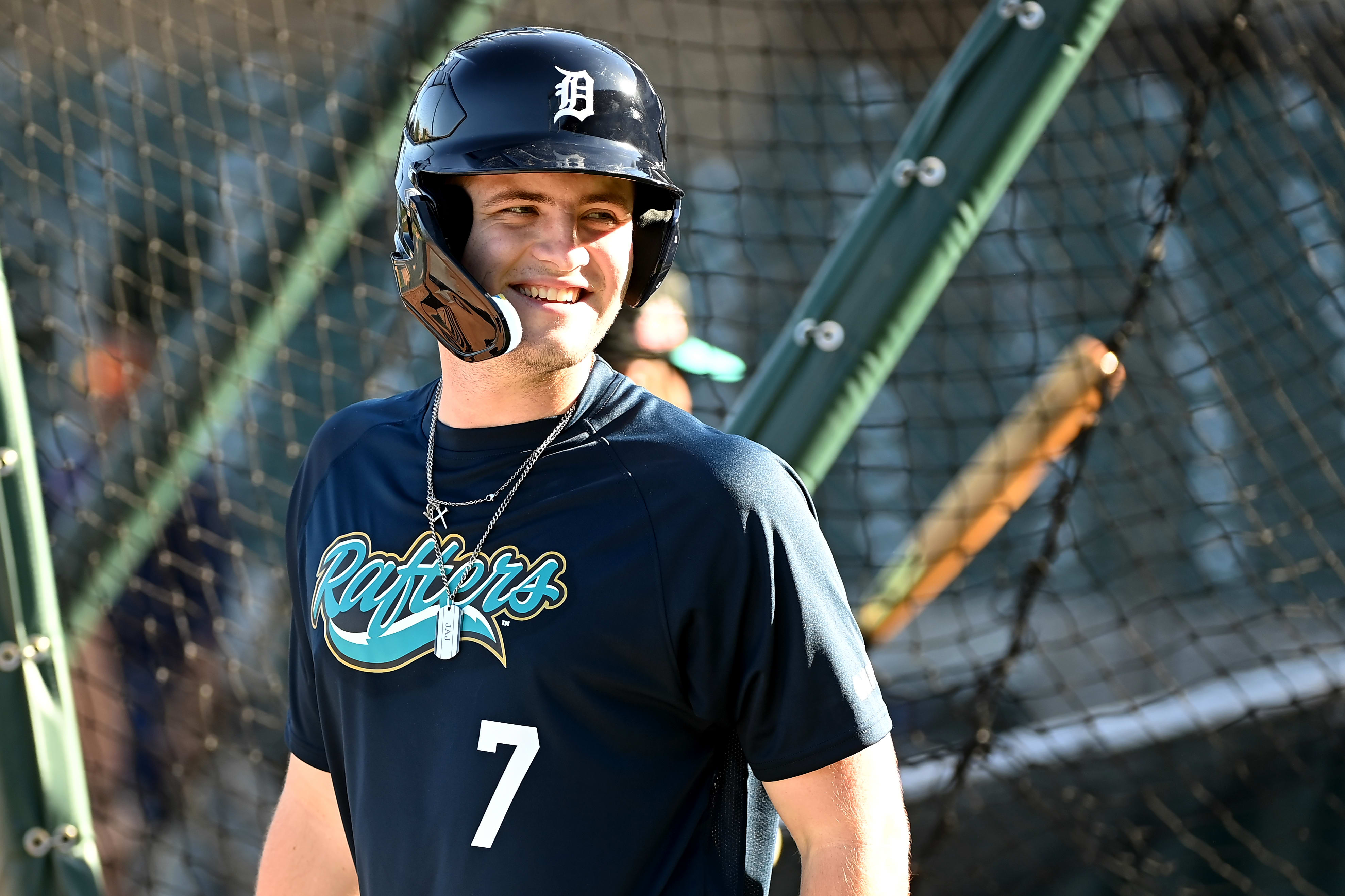 Jace Jung smiles in a batting cage