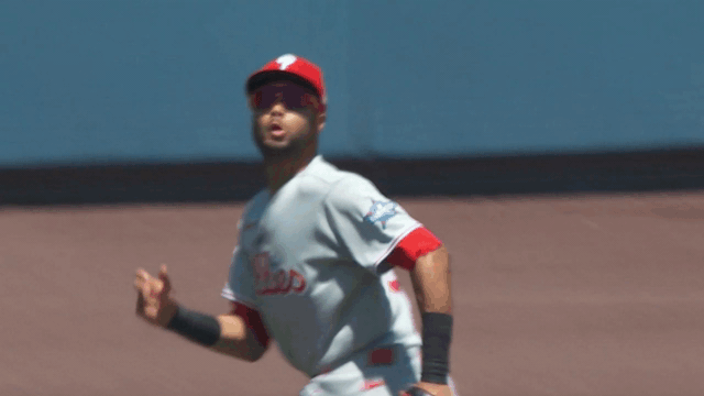 An animated gif of Justin Crawford making a leaping catch against the wall
