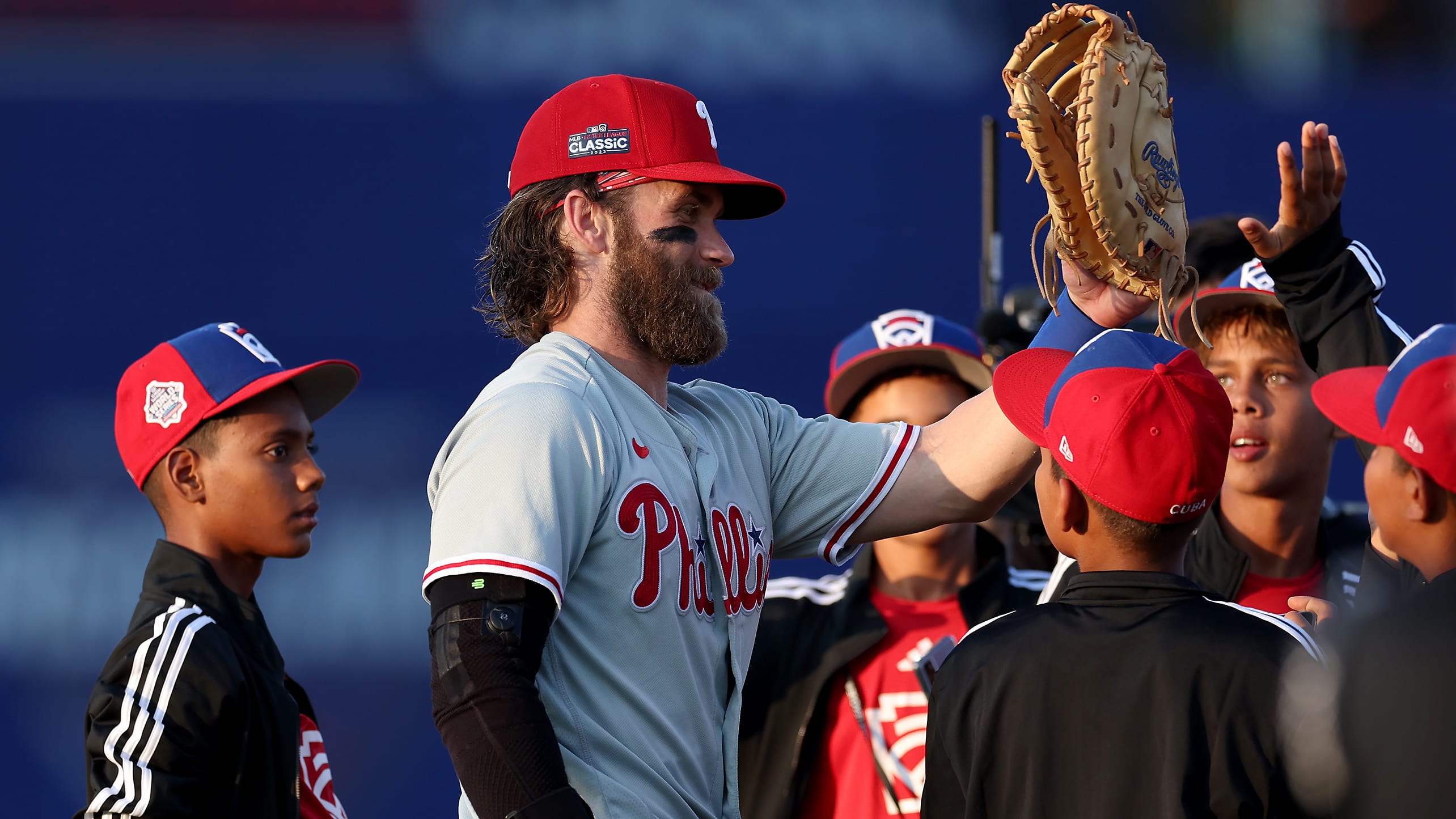 Bryce Harper high-fives Little League players