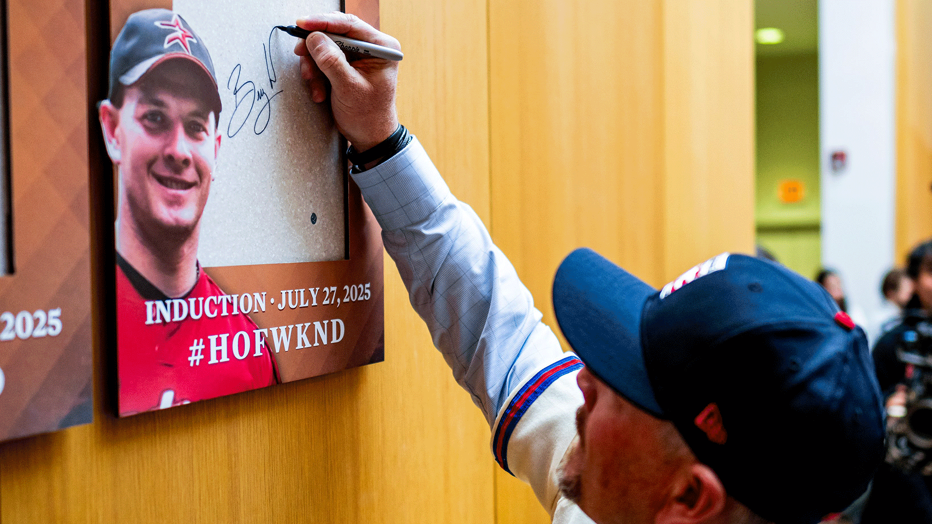 Billy Wagner signs the space where his Hall of Fame plaque will be hung