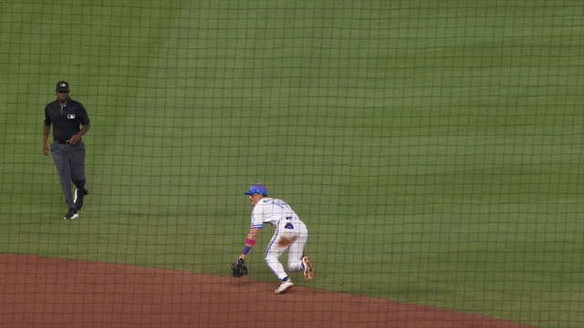 An animated gif of Michael Massey making a diving stop behind second base and flipping the ball to shortstop Tyler Tolbert, who spins and fires to first for the out