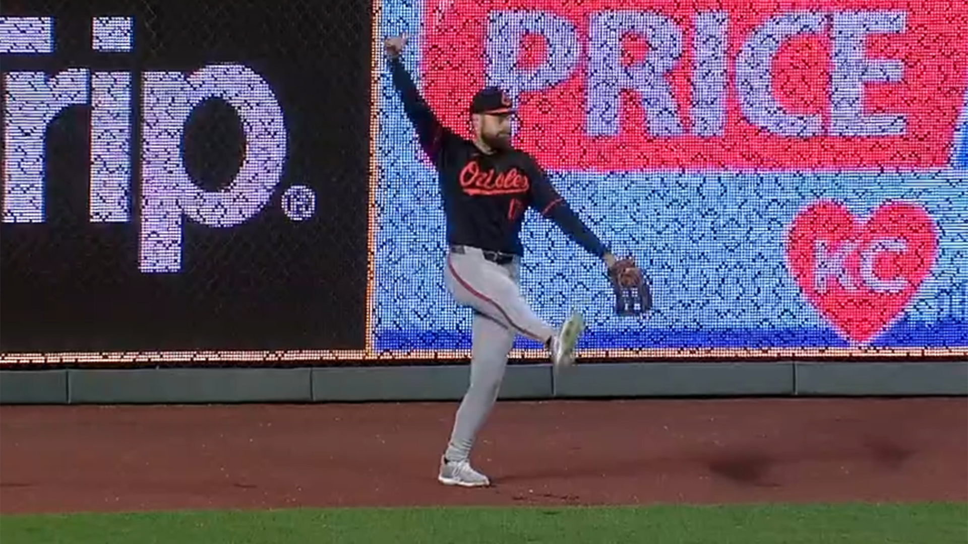 Colton Cowser tosses a baseball in the stands