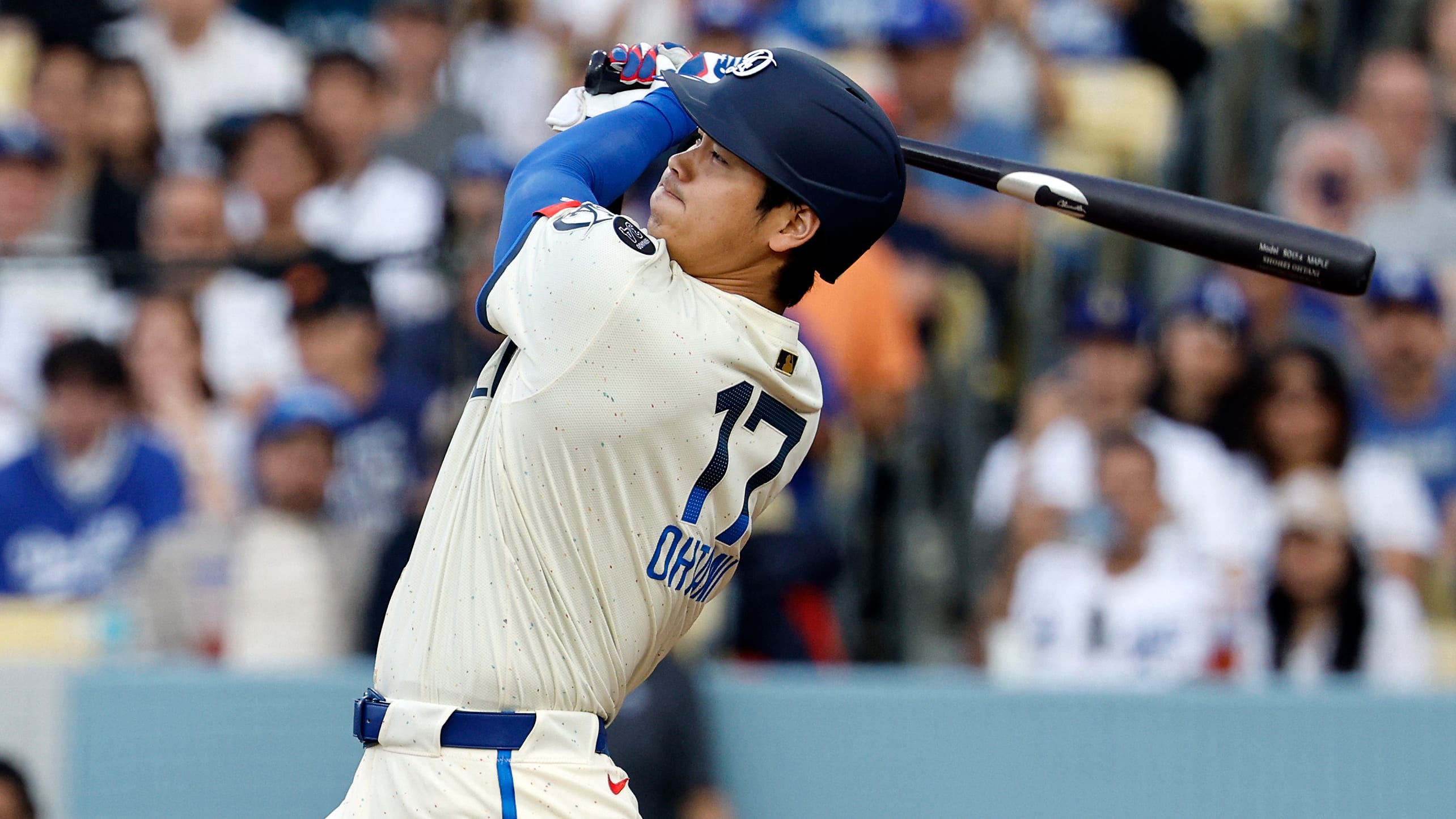 Shohei Ohtani watches the flight of his leadoff home run