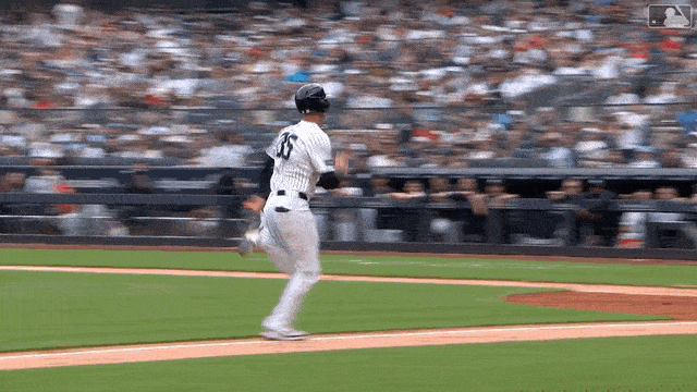 J.T. Realmuto tags Cody Bellinger at the plate just in time