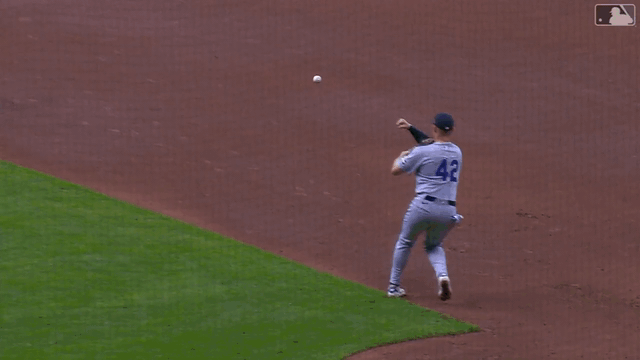 An animated gif of a first baseman's throw to second base glancing off the baserunner's shoulder and into the shortstop's glove for a forceout at second base