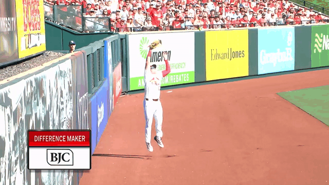 An animated gif of the Cardinals' Nathan Church making a leaping catch at the wall