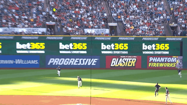 An animated gif of Brayan Rocchio making an over-the-shoulder catch in short left field
