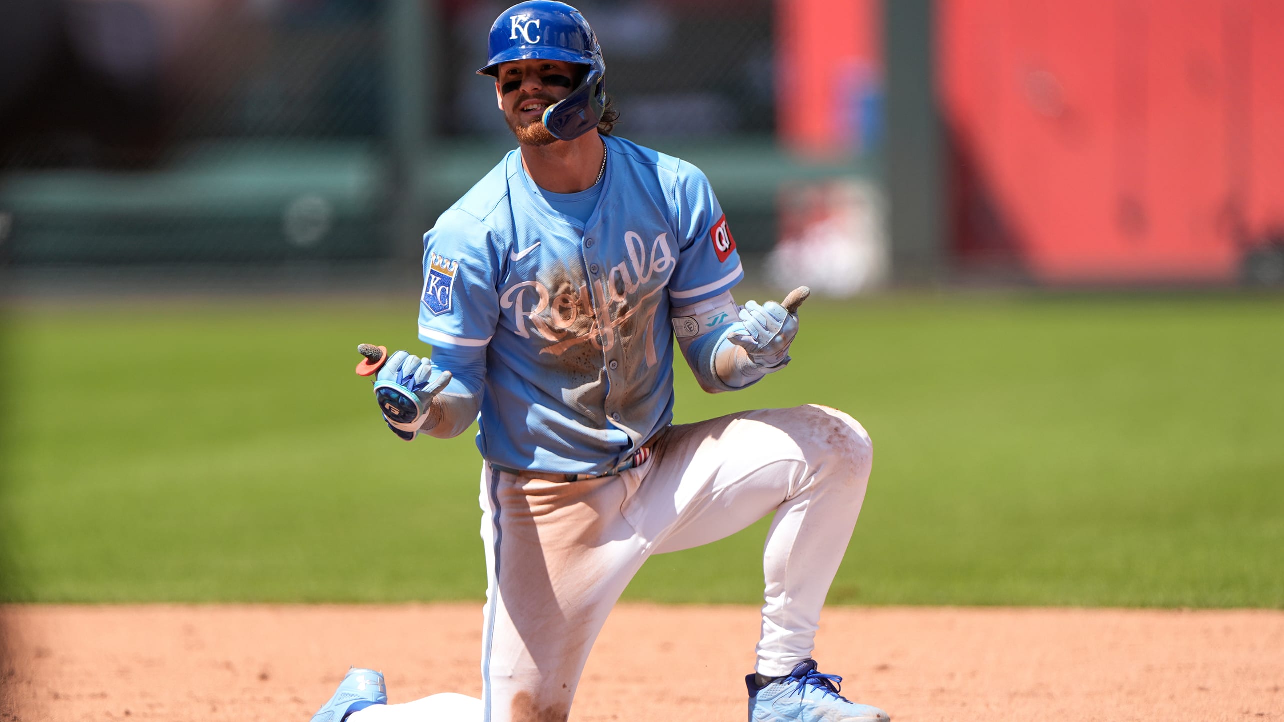 Bobby Witt Jr. looks toward the dugout after sliding into second base