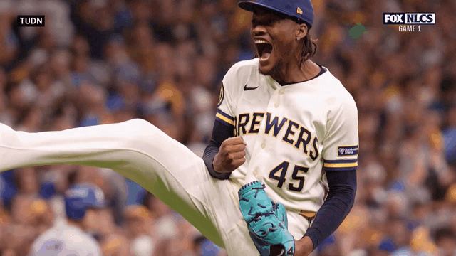 An animated gif of Abner Uribe celebrating a strikeout
