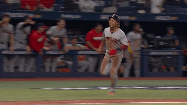 An animated gif of José Ramírez smiling as he scored a run in the ninth inning
