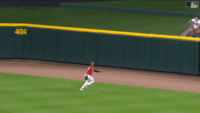 An animated gif of Will Benson making a leaping catch, crashing into the wall and falling to the ground
