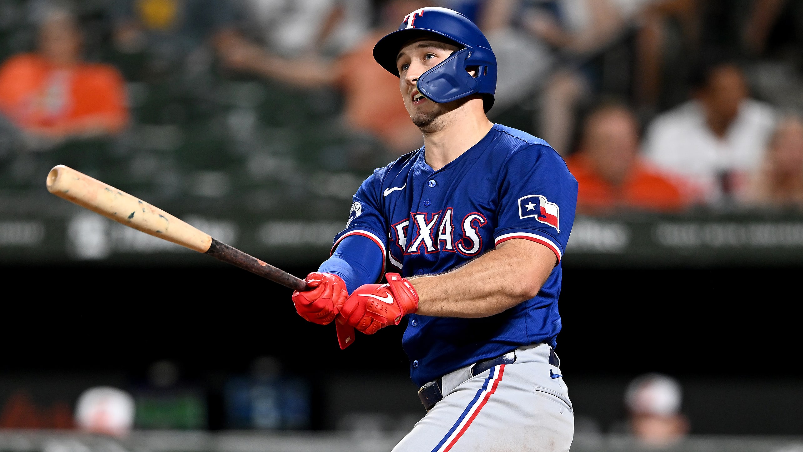 Wyatt Langford watches the flight of his home run