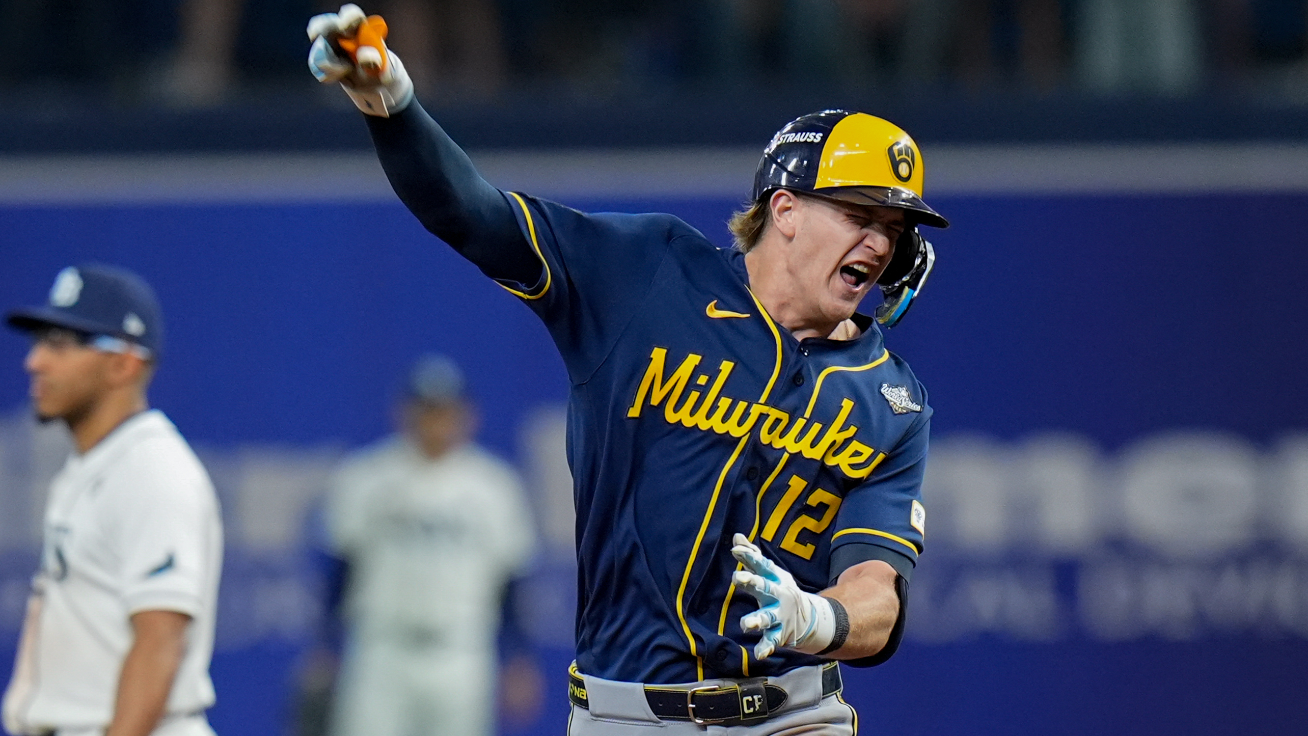 Cooper Pratt celebrates his home run as he rounds the bases