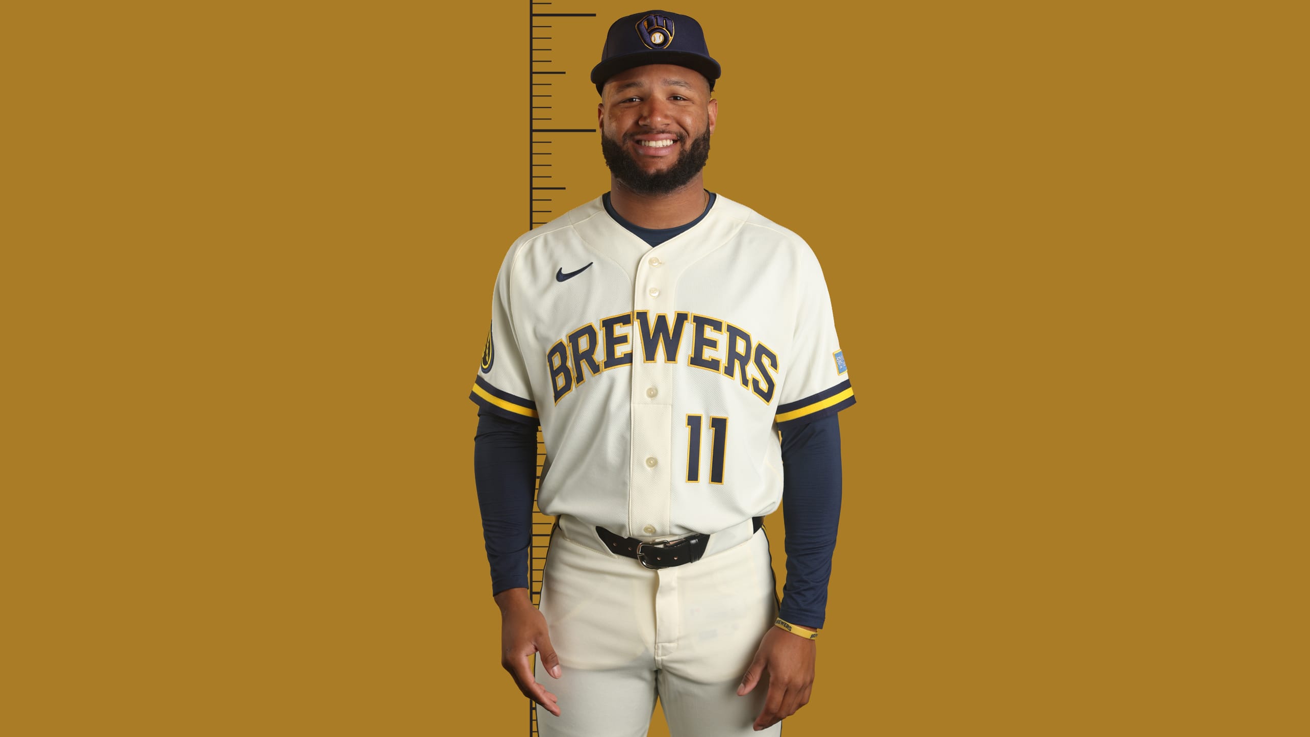 Jackson Chourio standing in front of a ruler