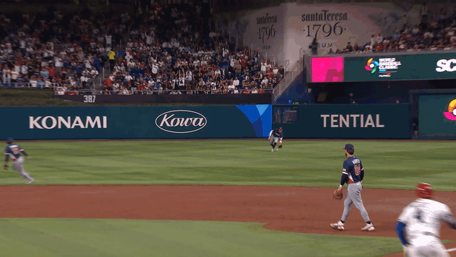 An animated gif of Gunnar Henderson tagging out Fernando Tatis Jr. at third base