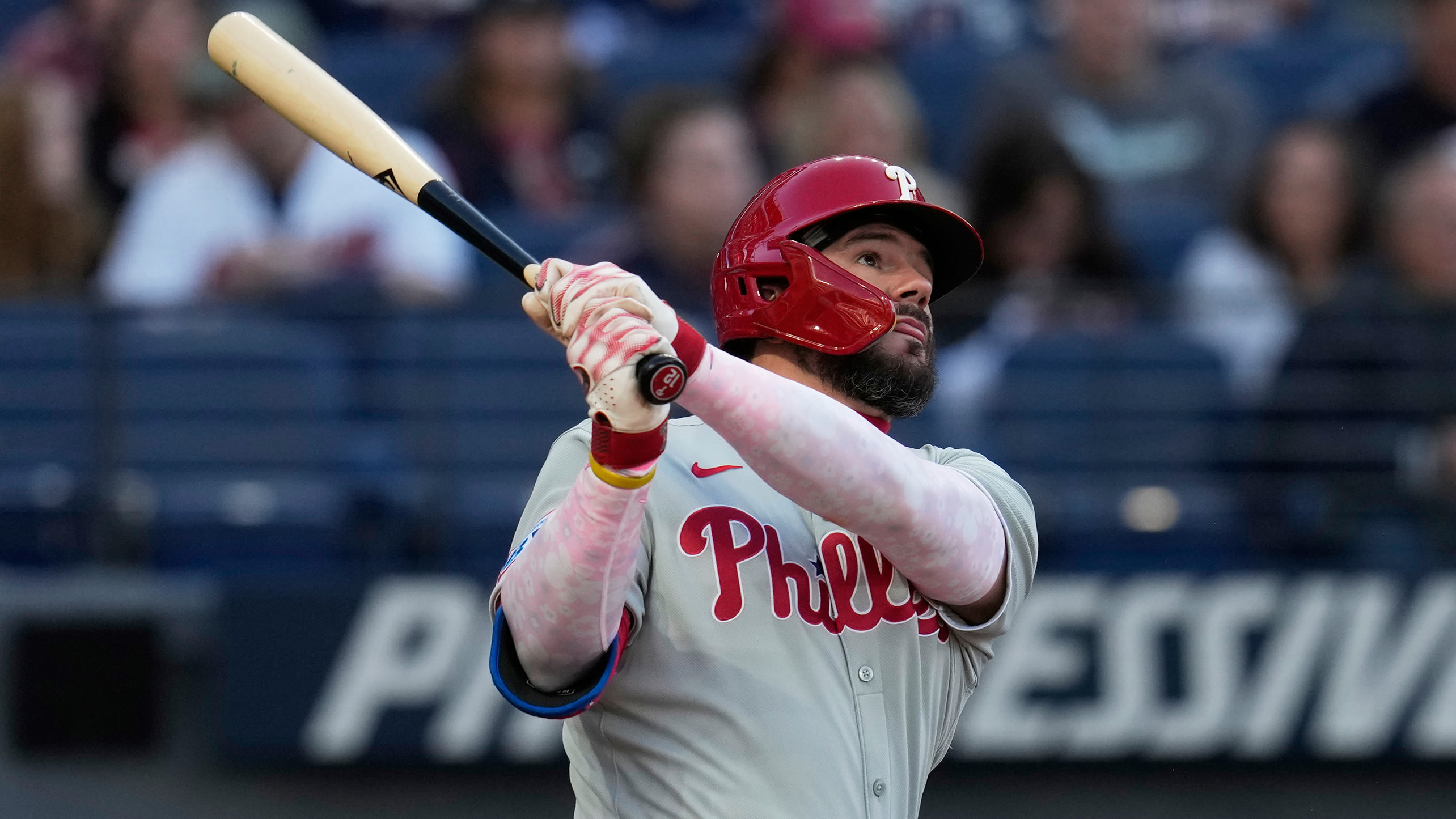 Kyle Schwarber watches the flight of a home run